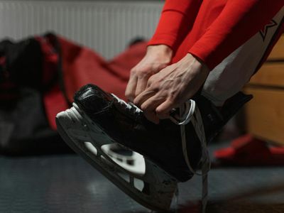 Man tying laces before a workout session